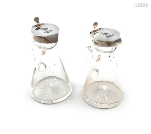 A pair of Edwardian silver-mounted cut glass whisky tots, by...