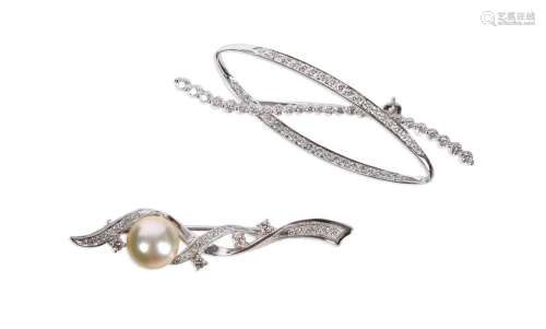 Two white gold brooches, one set with a cultured pearl and b...