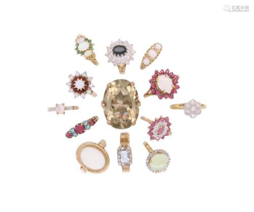 13 gem-set gold rings, including an opal and ruby half hoop ...