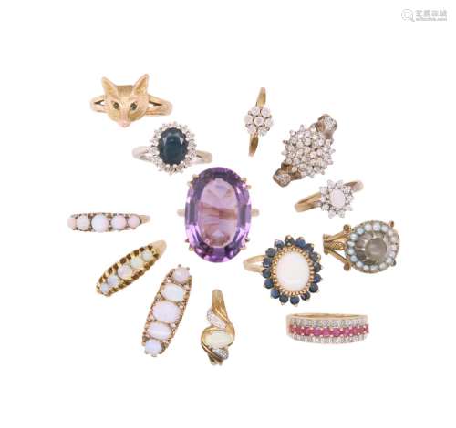 13 gem-set gold rings, including a sapphire and diamond clus...
