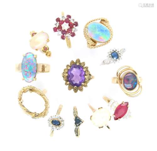 Twelve gem-set gold rings, including an opal cabochon-mounte...