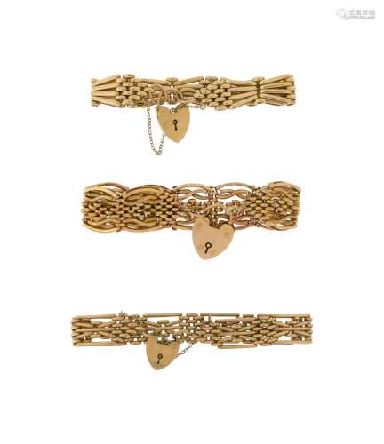 Three 9ct gold fancy gate-link bracelets, each with a 9ct go...