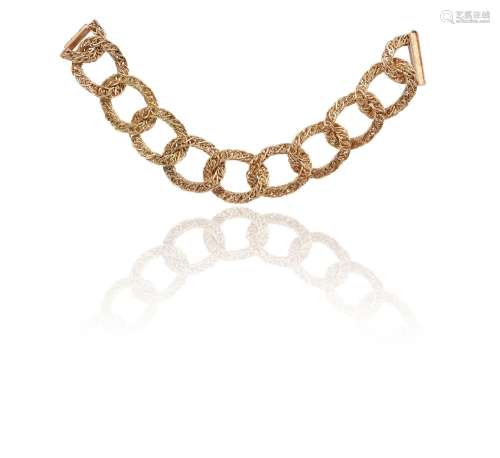 A fancy link 18ct gold bracelet, formed with large ropetwist...