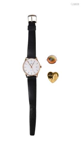 A 9ct gold wrist watch with quartz movement, dial signed Gar...