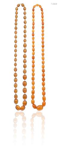 A graduated amber bead necklace, 72cm, 91g; and a gradauted ...