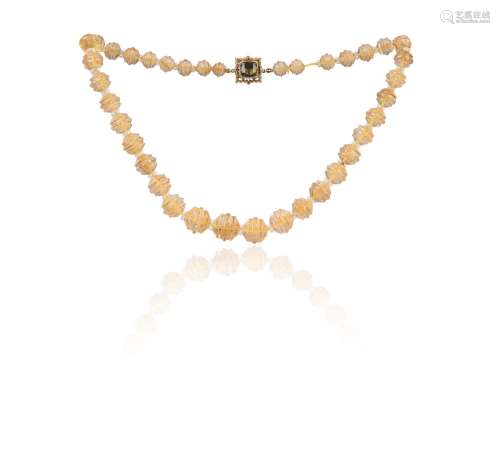 A graduated carved citrine bead necklace, the ornate square ...