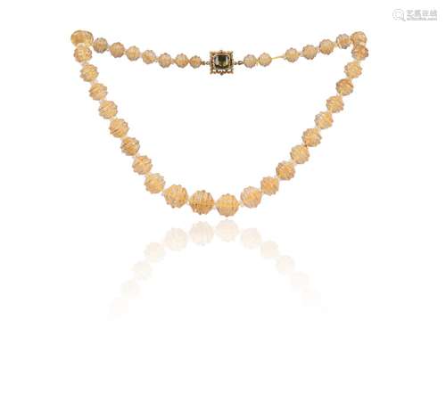 A graduated carved citrine bead necklace, the ornate square ...