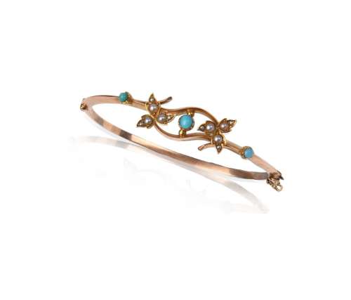 An Edwardian gold hinged bangle, set with turquoise cabochon...