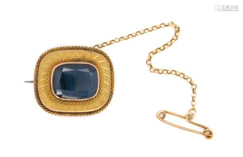 A sapphire brooch, set with a cushion-shaped sapphire in gol...