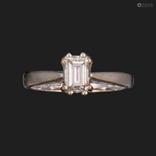 A diamond solitaire ring, set with a baguette-shaped diamond...