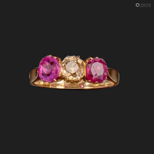 A ruby and diamond three-stone ring, the old cushion-shaped ...
