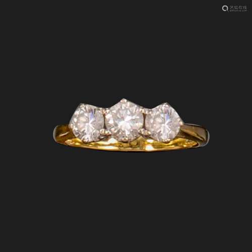 A diamond three-stone ring, the graduated round brilliant-cu...