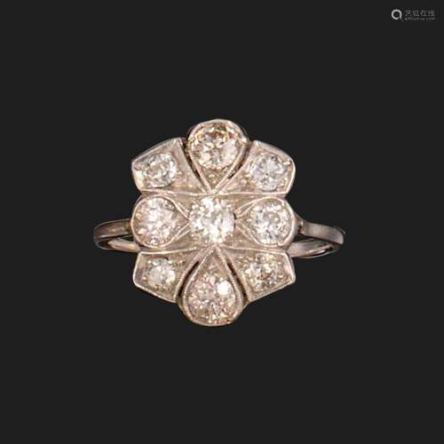 A diamond cluster ring, of quatrefoil design, set with old c...