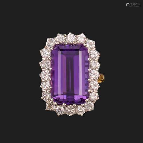 An amethyst and diamond cluster ring, set with an emerald-cu...