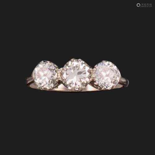 A diamond three-stone ring, set with three round brilliant-c...