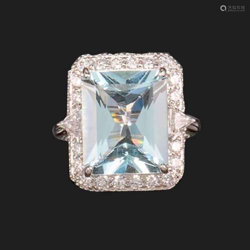 An aquamarine and diamond cluster ring, the rectangular mixe...