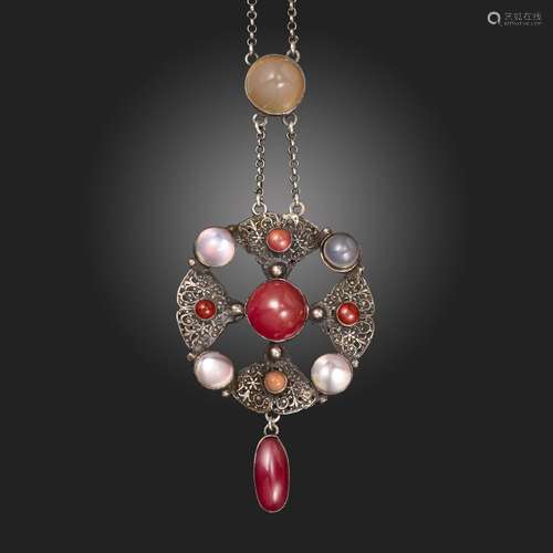 An Arts and Crafts silver, chalcedony and moonstone pendant ...