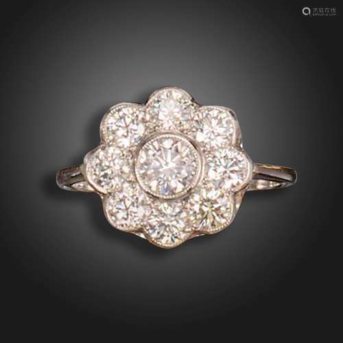 A diamond cluster ring, the flowerhead cluster rubover-set w...