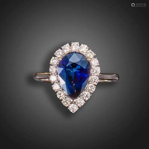 A sapphire and diamond cluster ring, the pear-shaped sapphir...