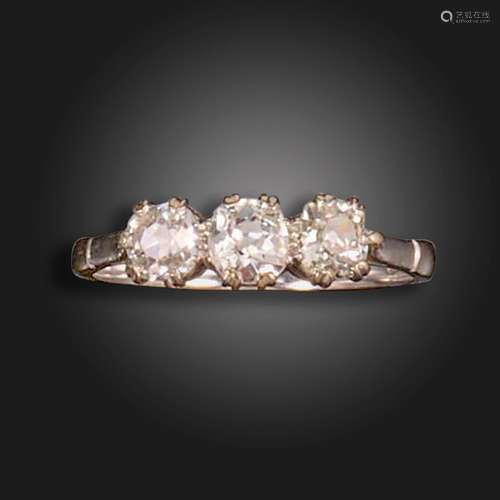 A diamond three-stone ring, set with three old cushion-shape...