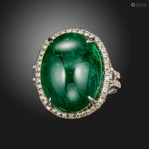 An emerald and diamond cluster ring, the large cabochon emer...