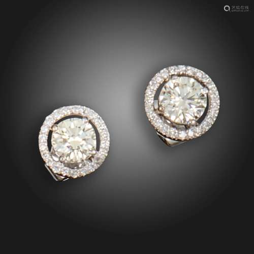 A pair of diamond cluster stud earrings, the round brilliant...