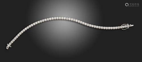 A diamond line bracelet, the round brilliant-cut diamonds ar...