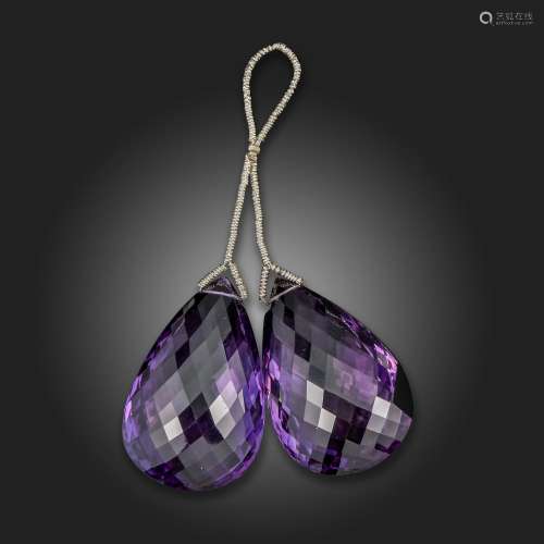A double amethyst pendant, set with two briolette-cut amethy...