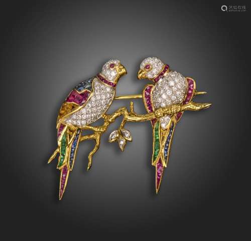 A gem-set gold parrot brooch, the two parrots perched on a b...