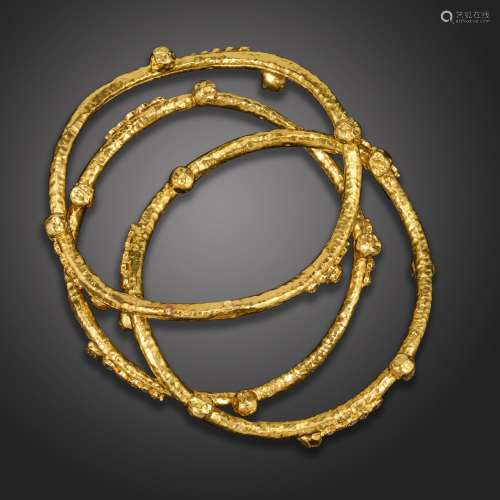 Three diamond-set gold bangles, each undulating bangle with ...