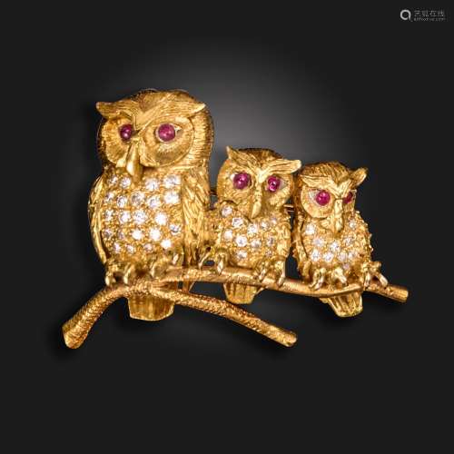 A gem-set gold owl brooch, realistically formed as three owl...