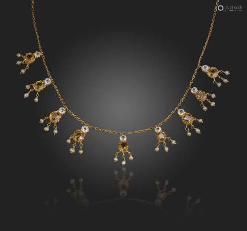 An Edwardian gem-set fringe necklace, set with pairs of cush...
