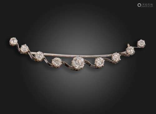 An Edwardian diamond crescent brooch, set with graduated old...