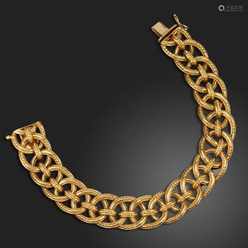 An 18ct gold bracelet by Garrard & Co., the oval links w...