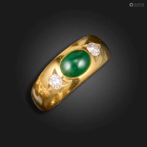An emerald and diamond three stone gypsy ring, set with a ca...