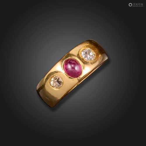 A ruby and diamond three stone gypsy ring, set with a caboch...