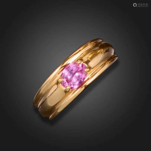 A pink sapphire ring by Boucheron, the oval pink sapphire se...