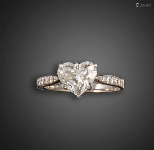 A diamond solitaire ring, the heart-shaped diamond weighing ...