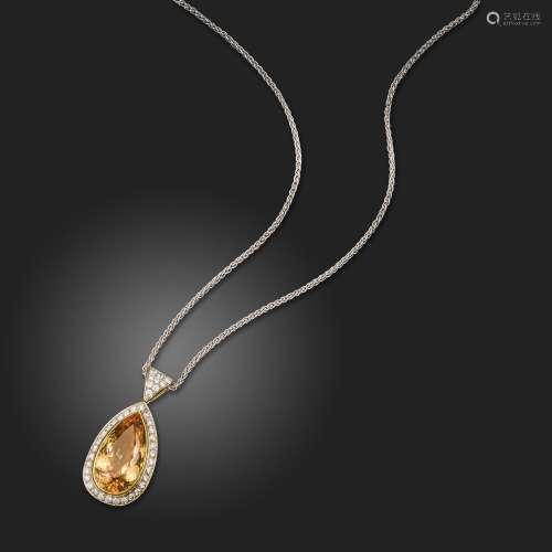 A golden topaz and diamond pendant, the pear-shaped topaz we...
