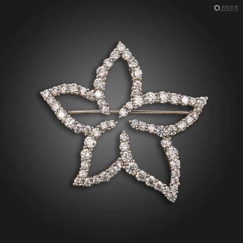 A stylised diamond-set flower brooch by Tiffany & Co, se...