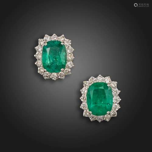 A pair of emerald and diamond cluster earrings, the cushion-...