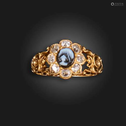 A mid 19th century gold mourning ring, set with a banded aga...