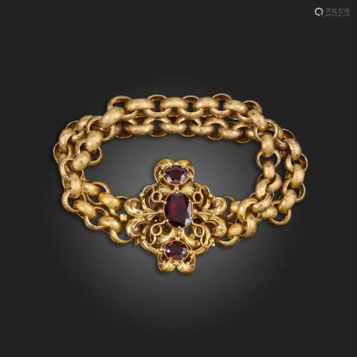 An early 19th century garnet gold bracelet, the scrolling re...