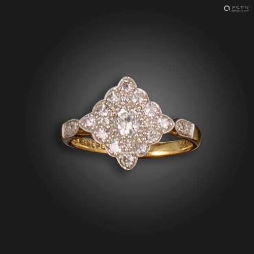 A diamond cluster ring, the lozenge-shaped ring head pave-se...