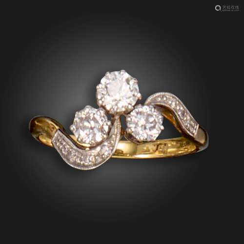 A diamond three-stone ring, set with a trefoil of graduated ...