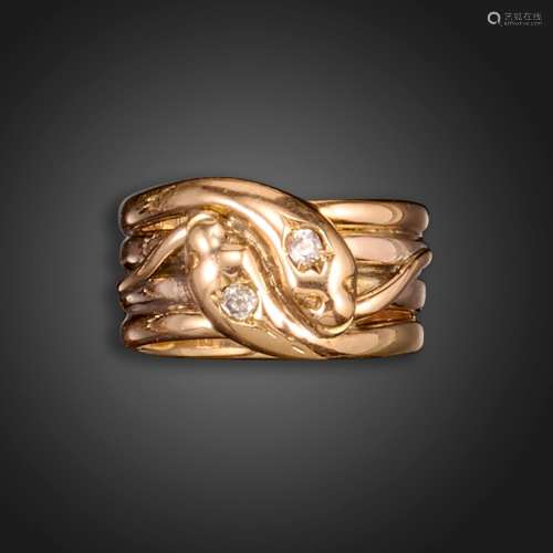 An early 20th century diamond-set snake ring, the two intert...
