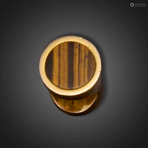 A tigers eye gold ring by Larry, c.1970s, set with a circula...