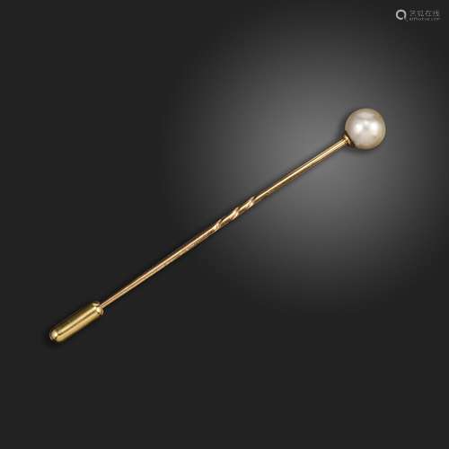 A natural pearl stick pin, set with a natural pearl in gold,...