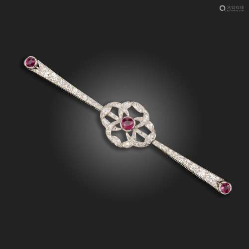 A ruby and diamond bar brooch, set in white gold, 7.5cm wide...
