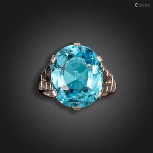 An aquamarine ring, the cushion-shaped aquamarine weighs app...